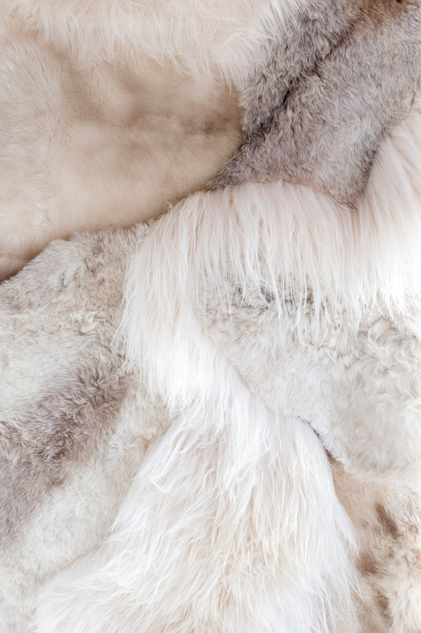 Closeup view of the different colors and textures of the cream melange sheepskin