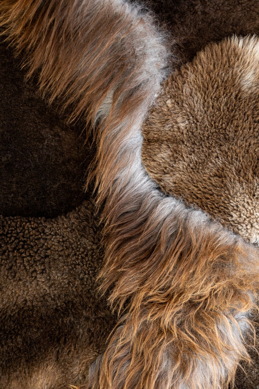 Closeup view of the different colors and textures of the brown melange sheepskin