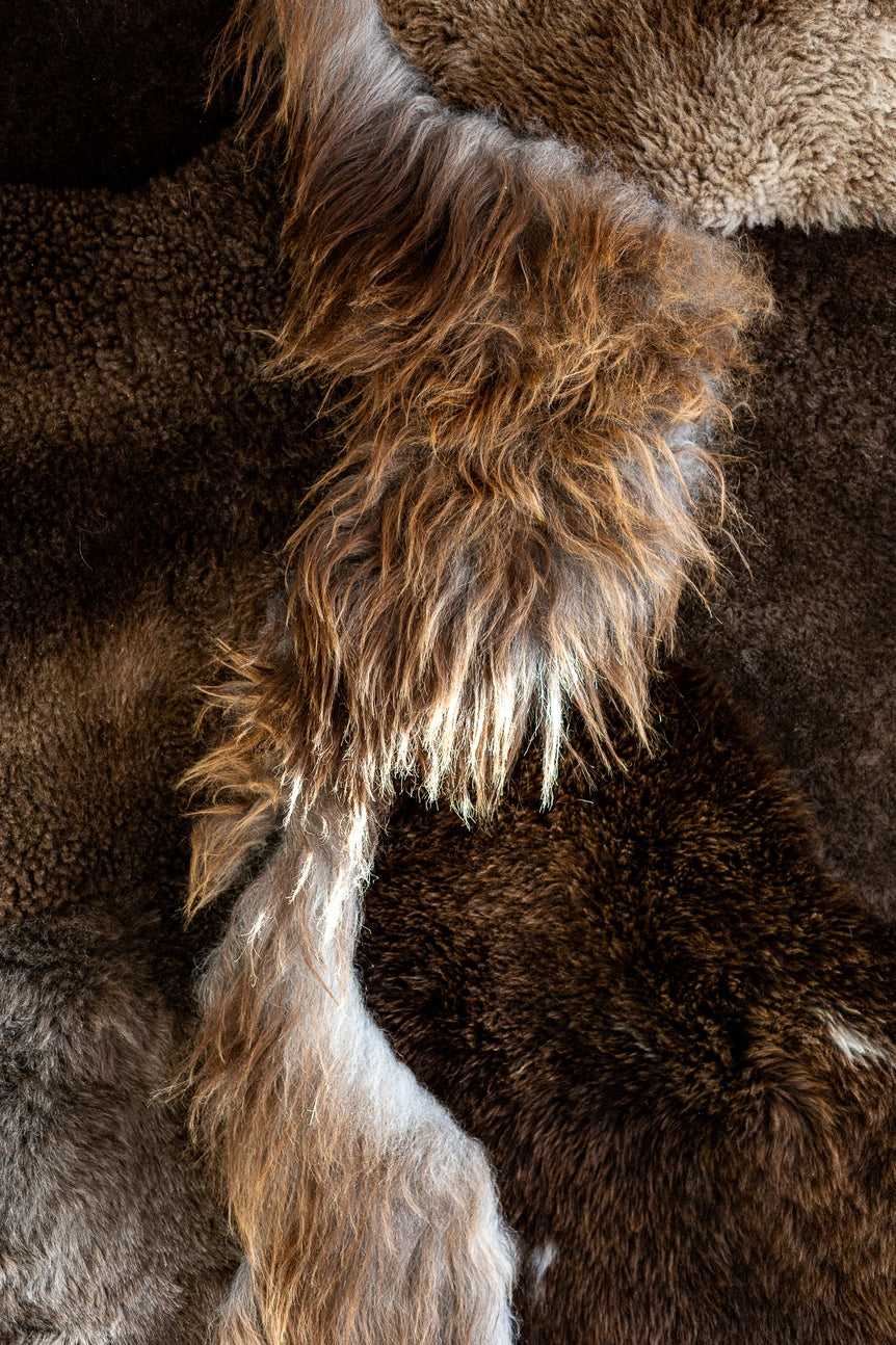 Closeup view of the different colors and textures of the brown melange sheepskin