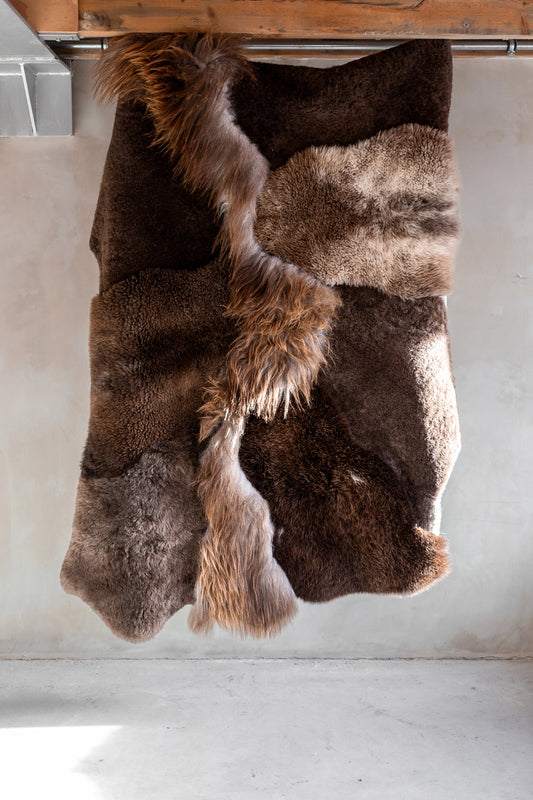 Full view of the different colors and textures of the brown melange sheepskin rug